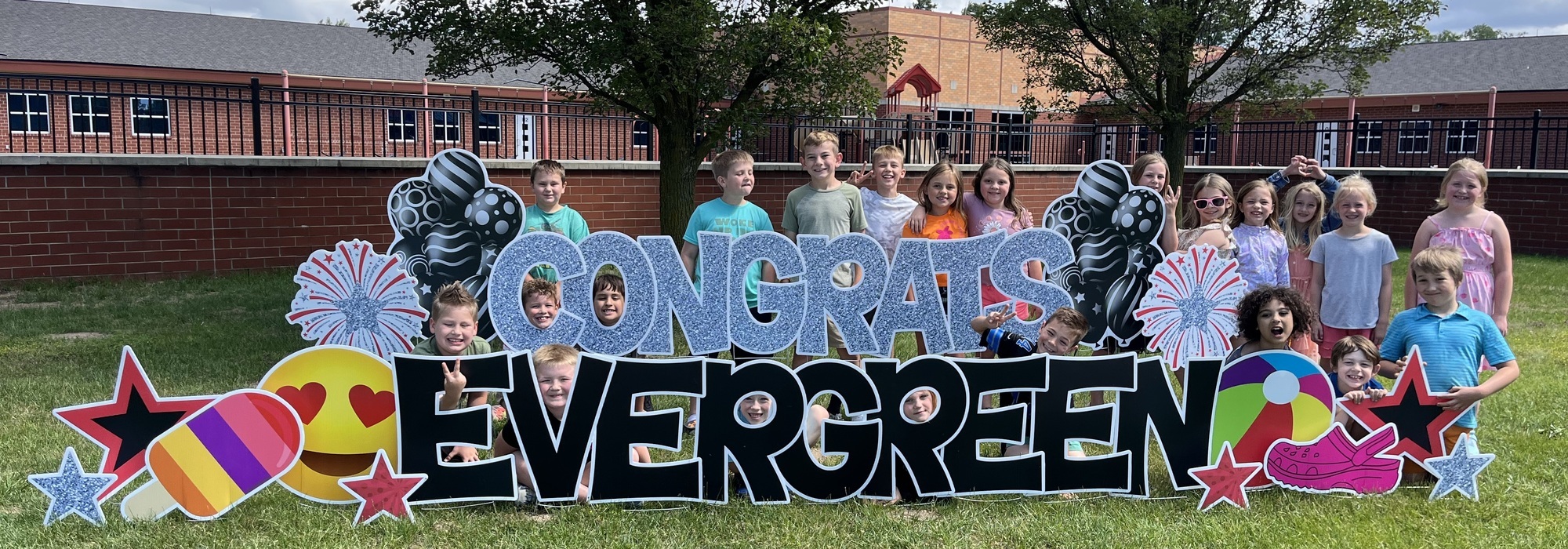 Evergreen students in front of the school